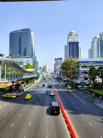 a city street with cars driving down it