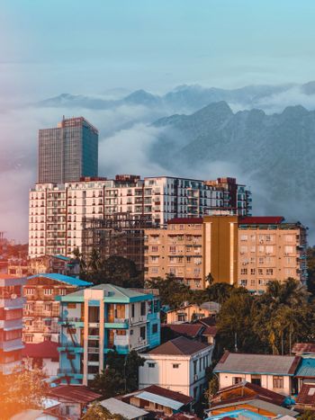 a view of a city with mountains in the background