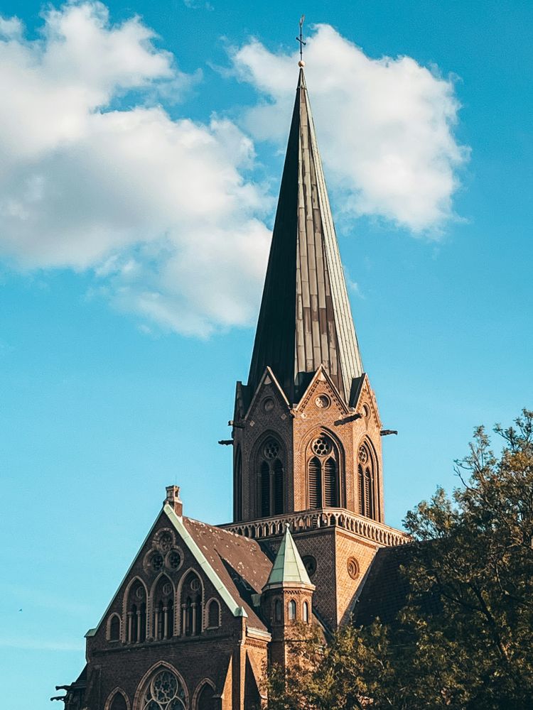 a church steeple with a clock on it