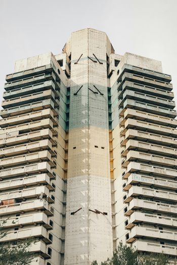 a tall building with a clock on the side of it