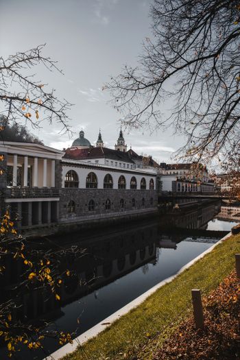 a building sitting next to a body of water