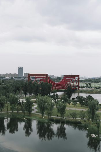 a large red bridge over a body of water