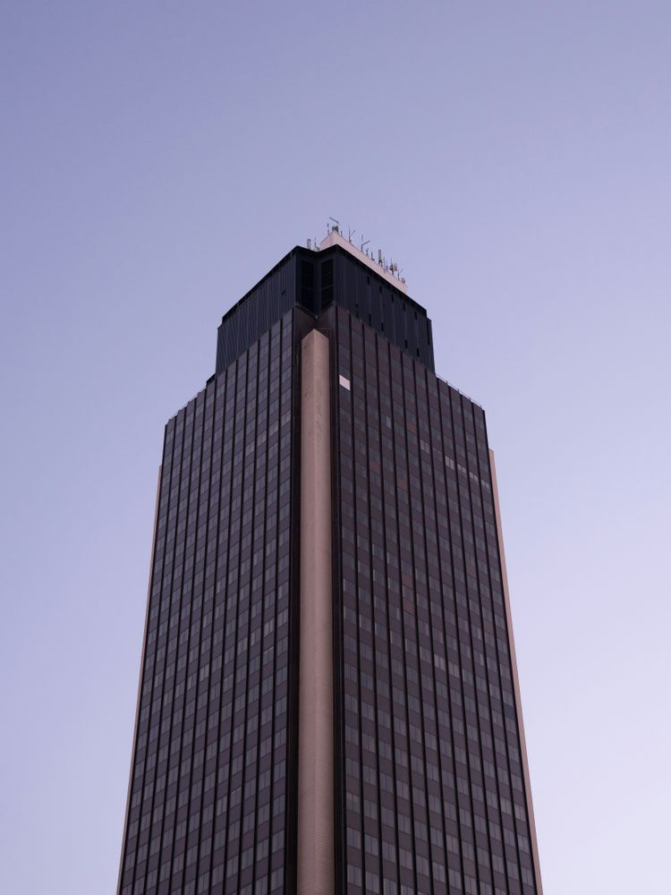 a tall building with a clock on the top of it