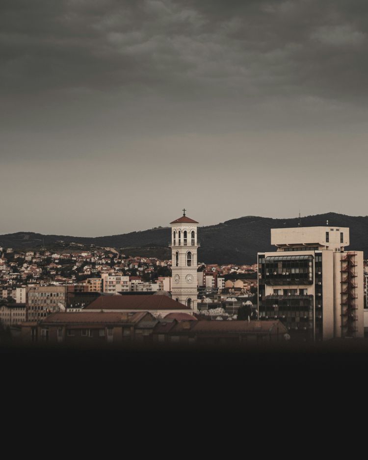 a view of a city with a clock tower