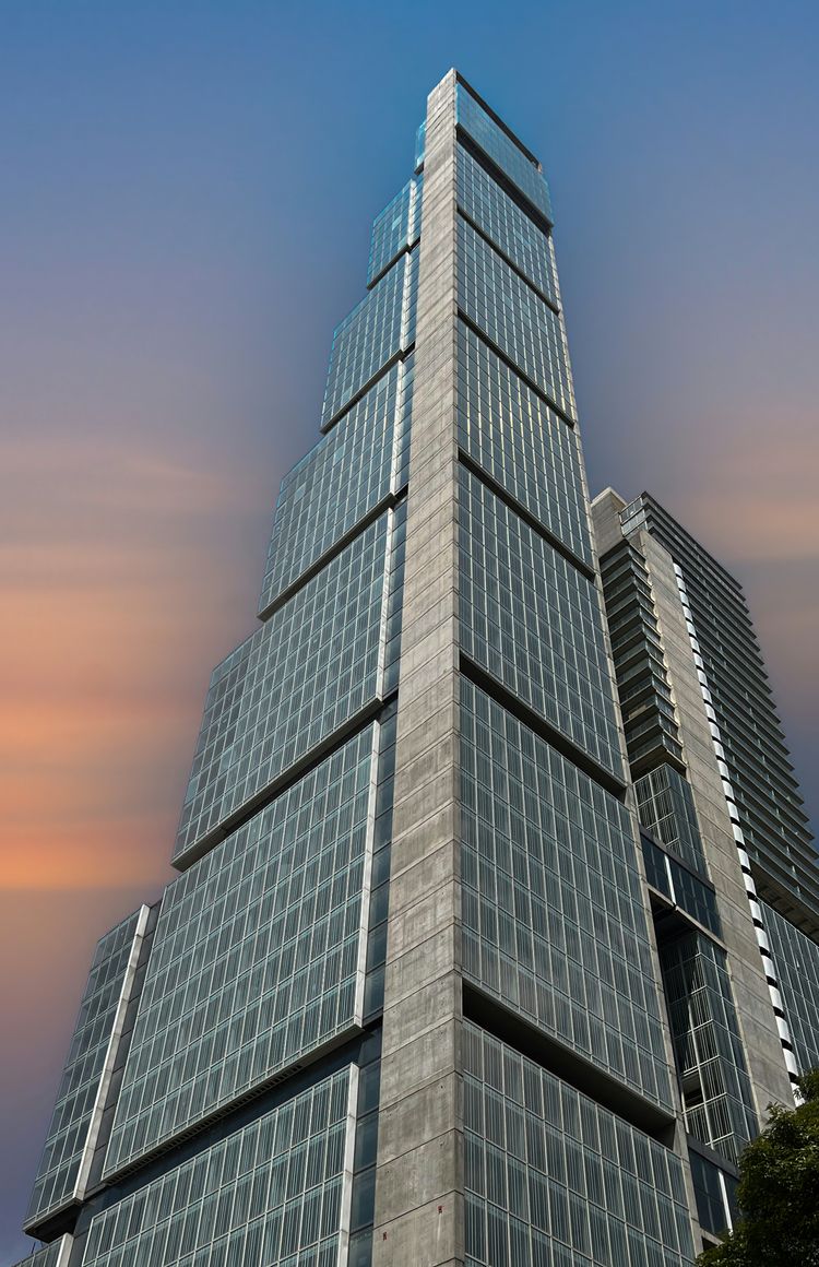 a very tall building with a sky background