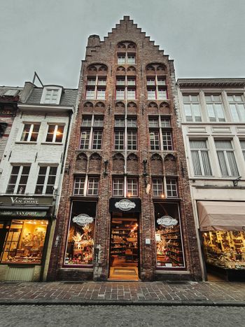 a tall building with a clock on the front of it