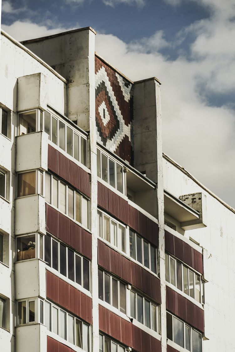 white and brown concrete building under blue sky during daytime