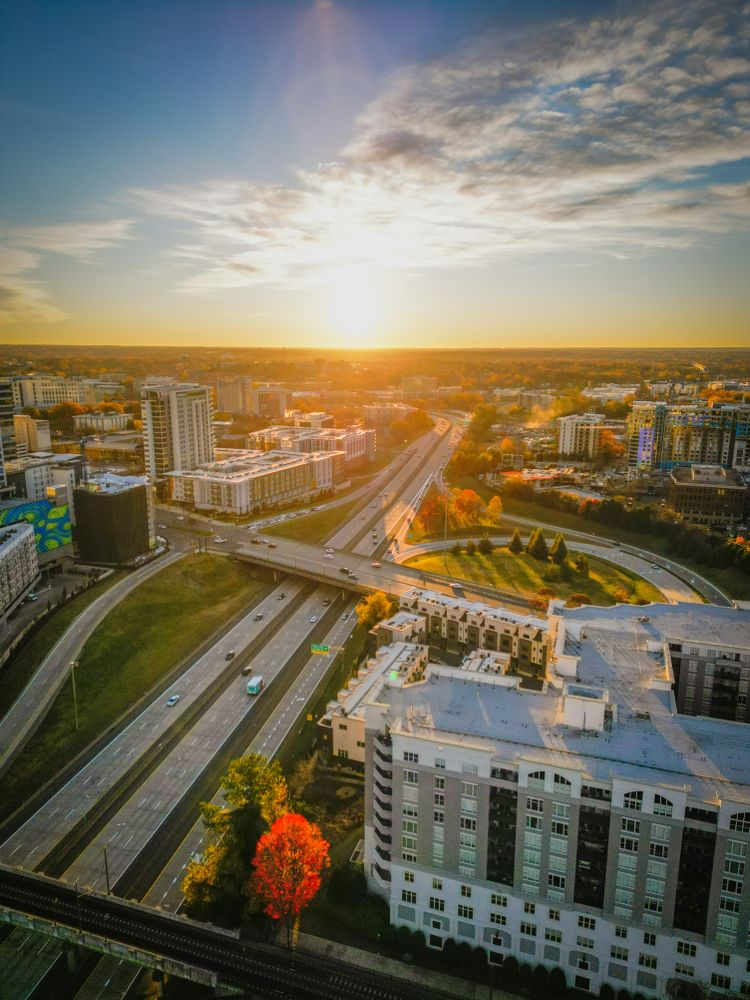 an aerial view of a city at sunset