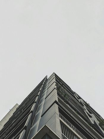 low angle photography of gray concrete building