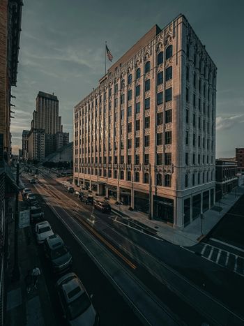 a very tall building sitting on the side of a road