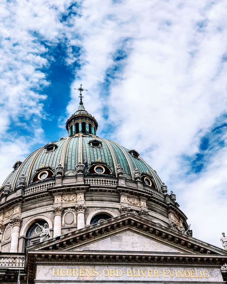 a dome on top of a building with a sky background