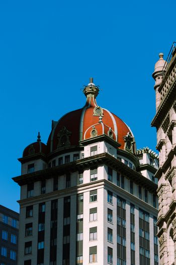 a large building with a red dome on top