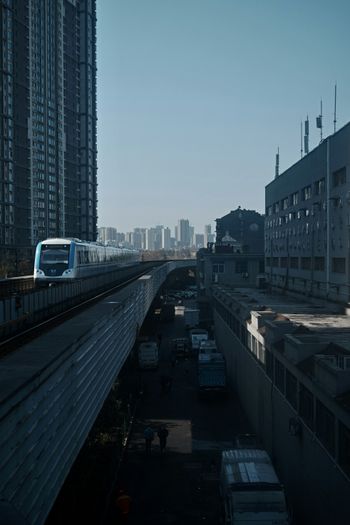 white and blue bus on road during daytime