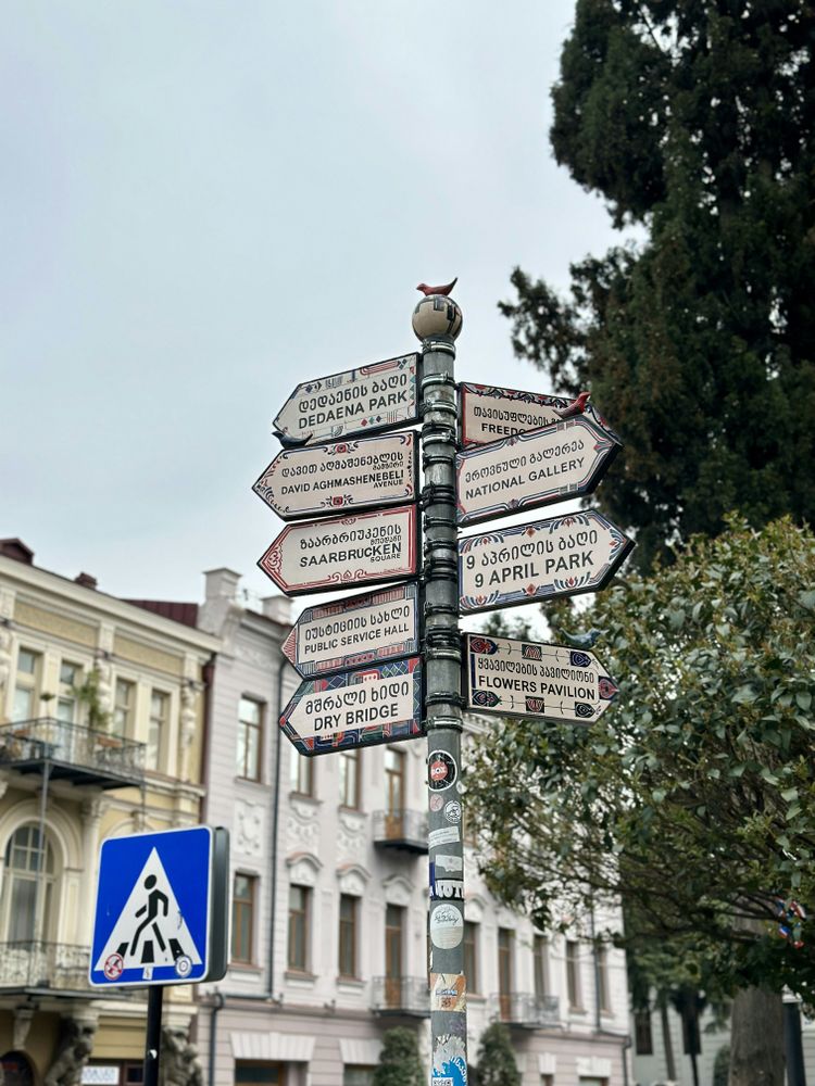 a pole with a bunch of street signs on it