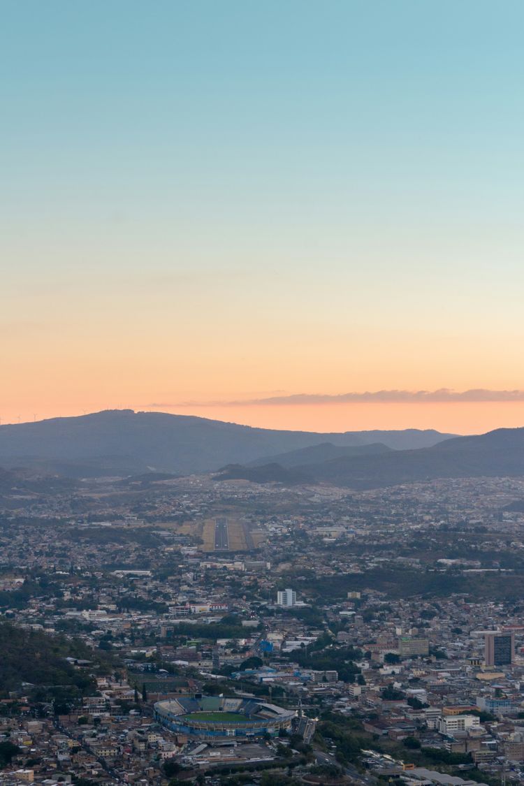 a view of a city with mountains in the background