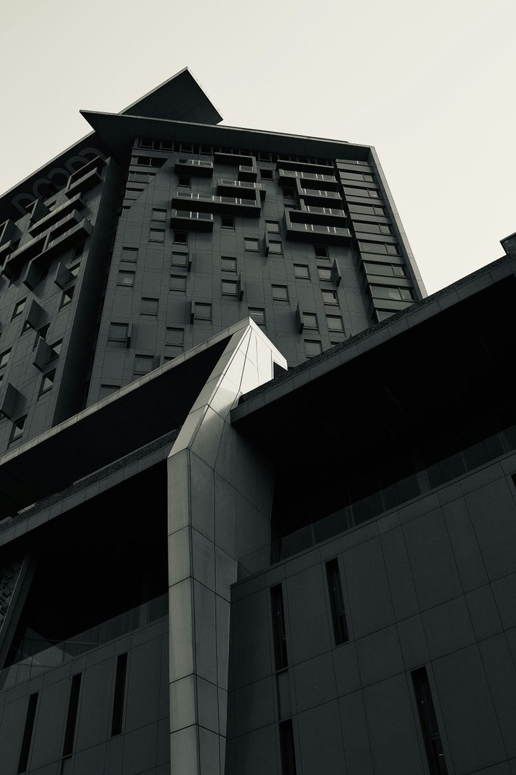 a black and white photo of a tall building