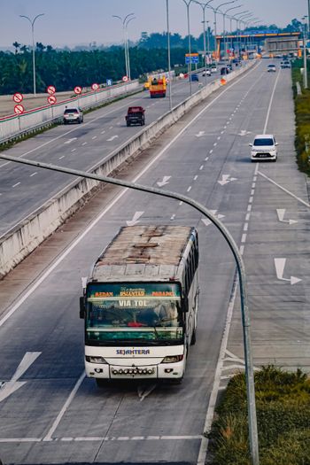 white and black bus on road during daytime