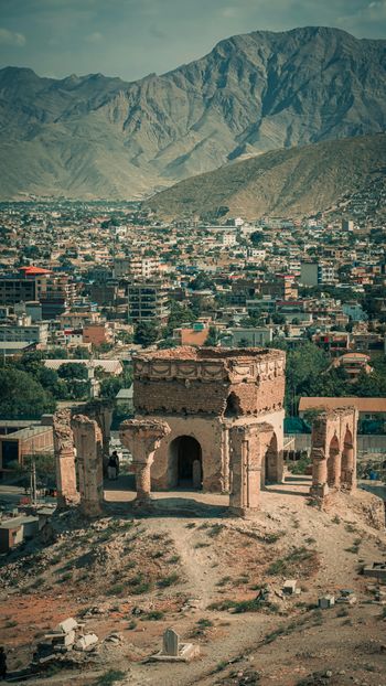 a city with a mountain in the background