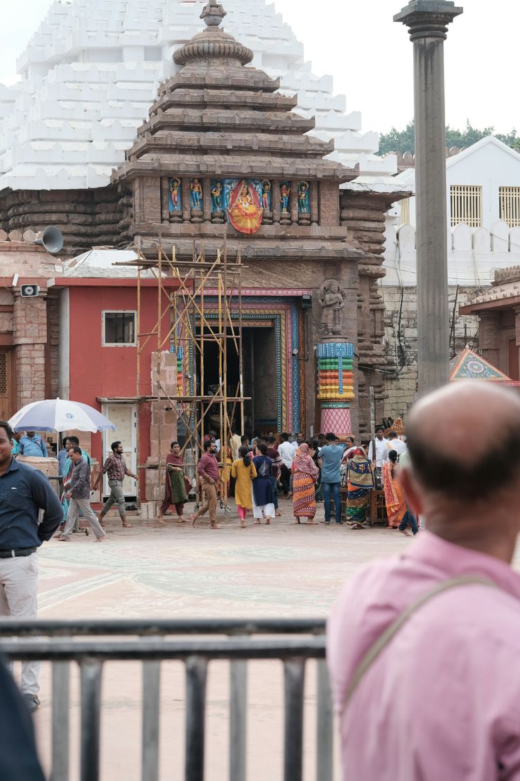A group of people standing around a building