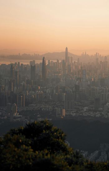 a city with a large body of water in the background