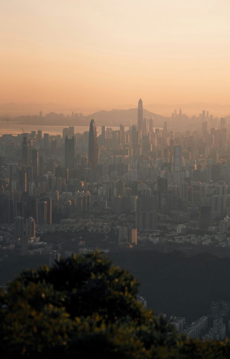 a city with a large body of water in the background