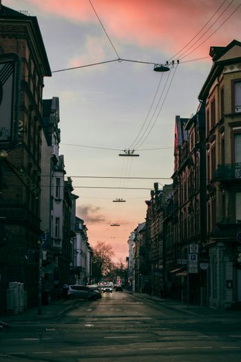 a city street with cars parked on the side of it