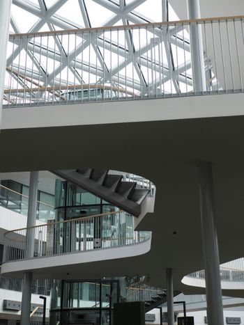 a staircase in a building with a skylight above it