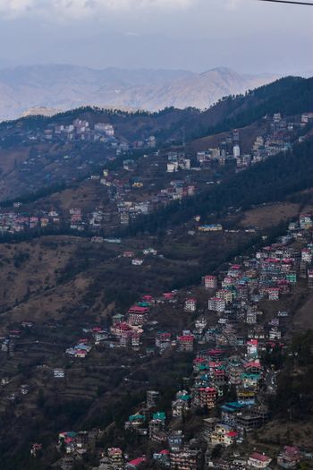 a view of a city with mountains in the background