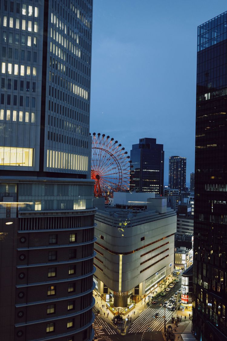 A view of a city at night from the top of a building