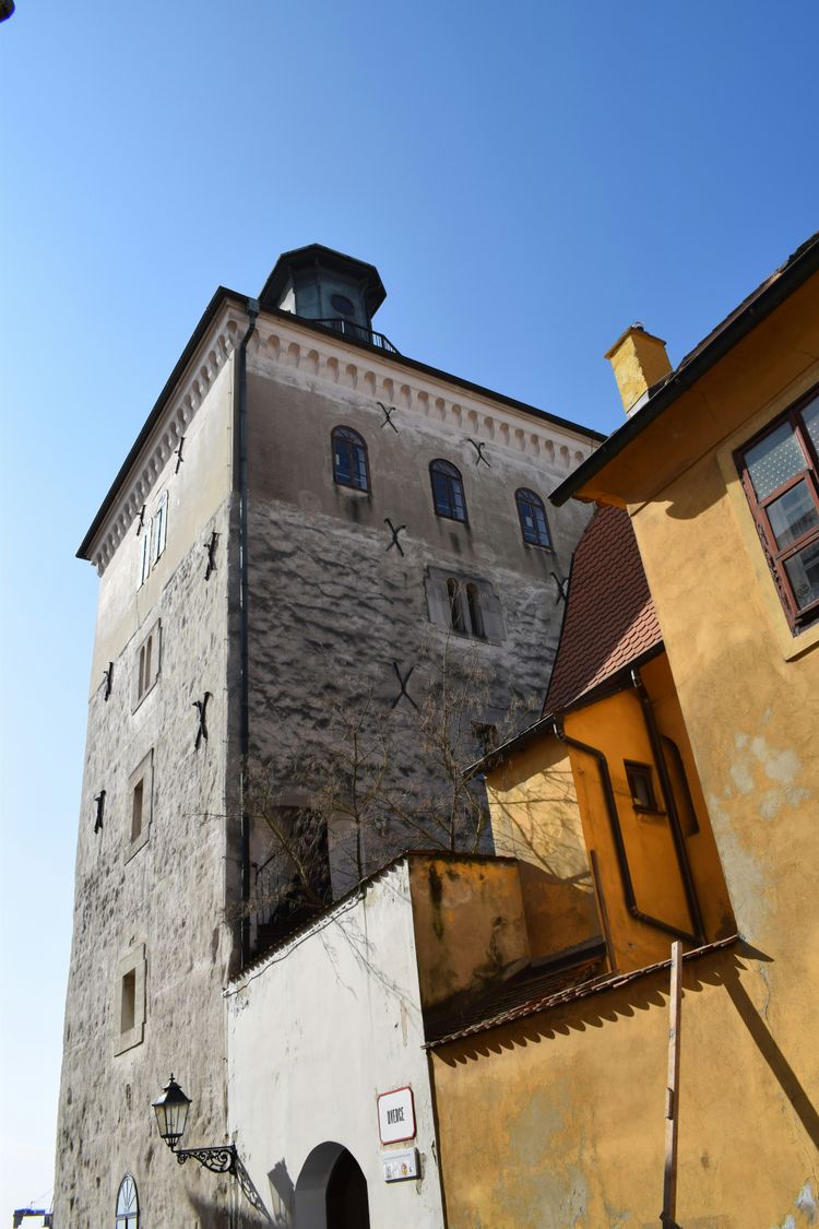 a tall building with a clock on the top of it