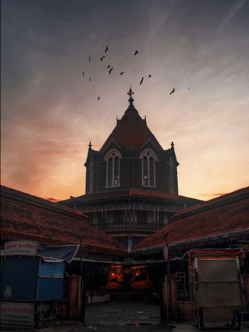 a large building with a tower and a clock on it