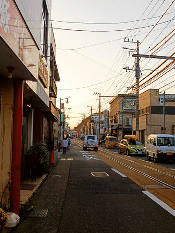 a street with cars parked on the side of it