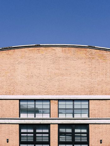 a large building with a clock on the side of it