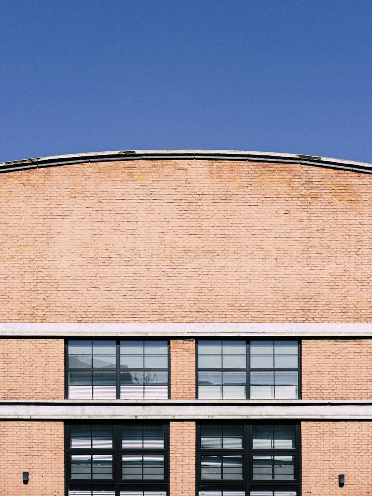 a large building with a clock on the side of it