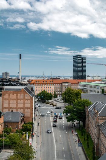 cars on road near buildings during daytime