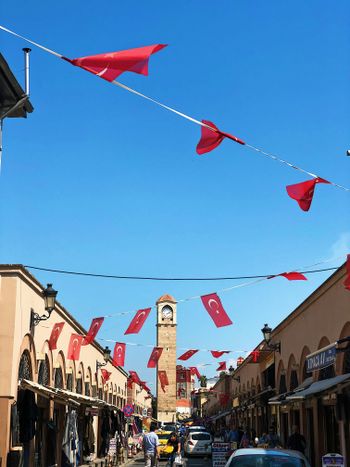 a city street with a clock tower in the background