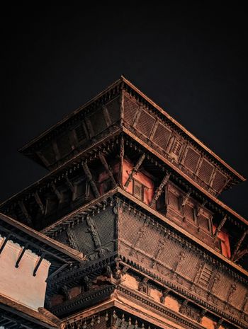 A tall tower with a clock on top of it