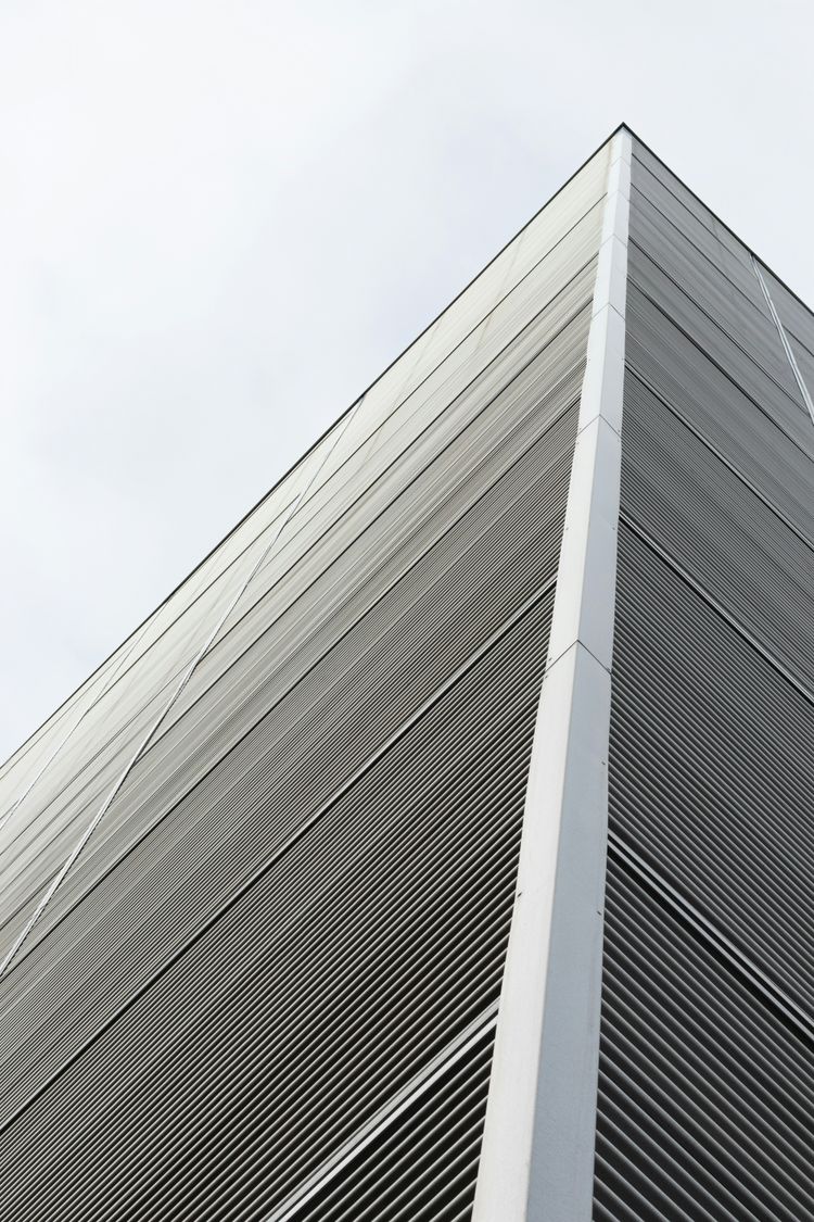 white concrete building under white sky during daytime