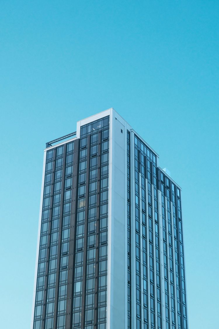 a very tall building with a sky background