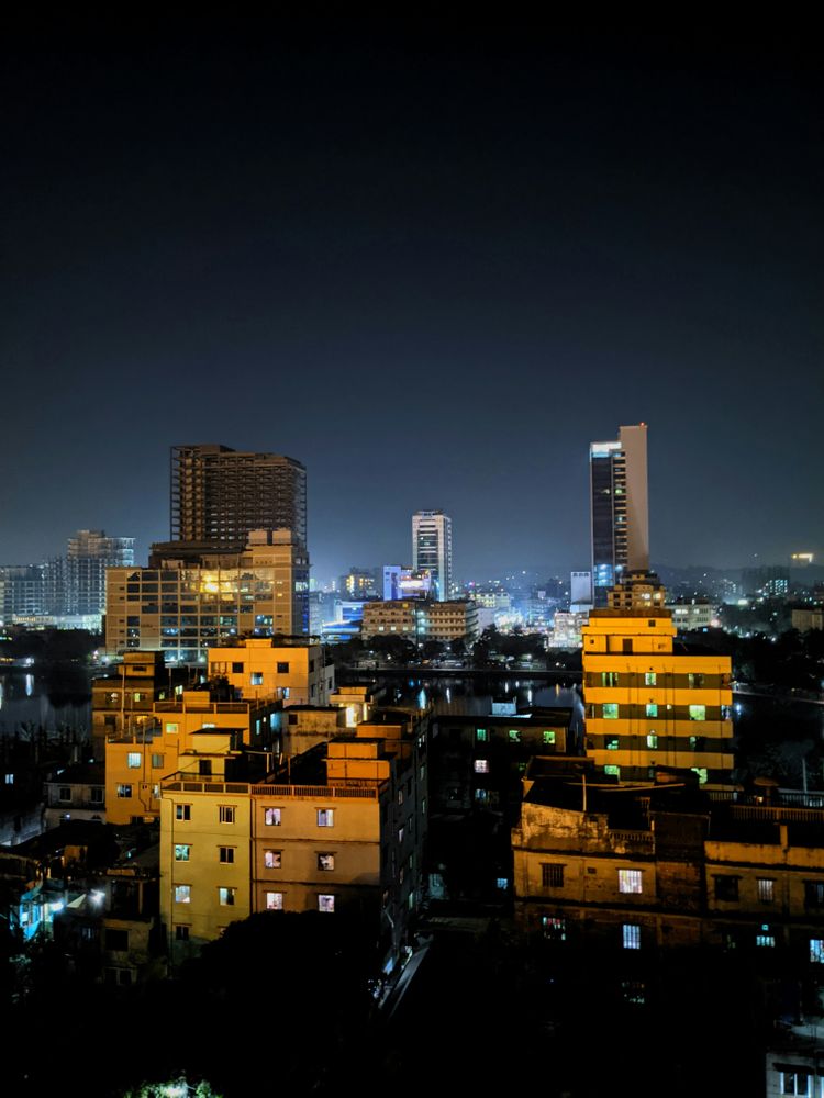 city with high rise buildings during night time