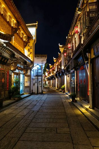 an empty street at night in a chinese town
