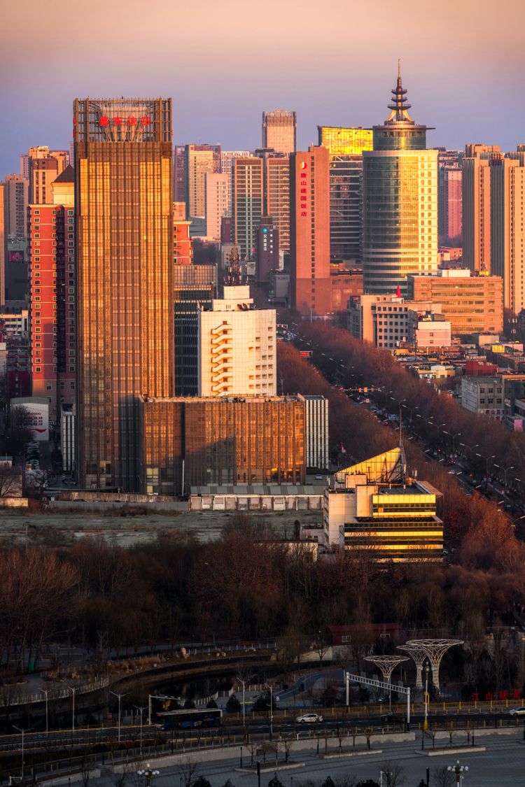 a view of a city with tall buildings