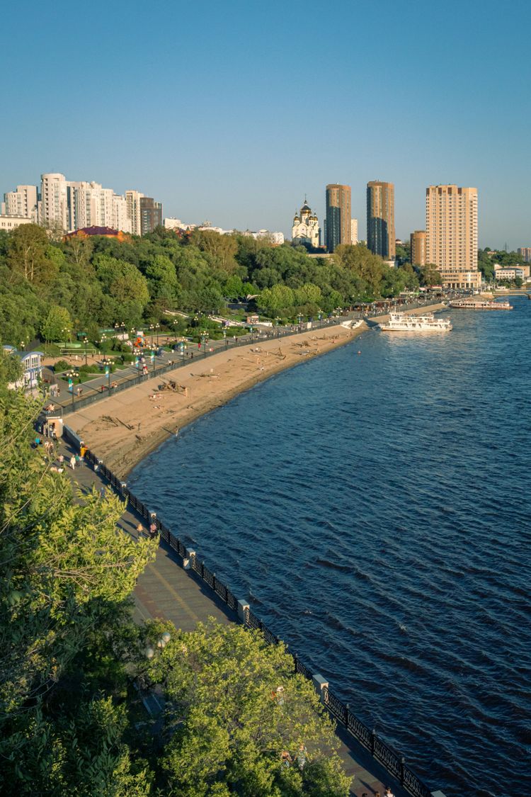 A view of a large body of water with a city in the background