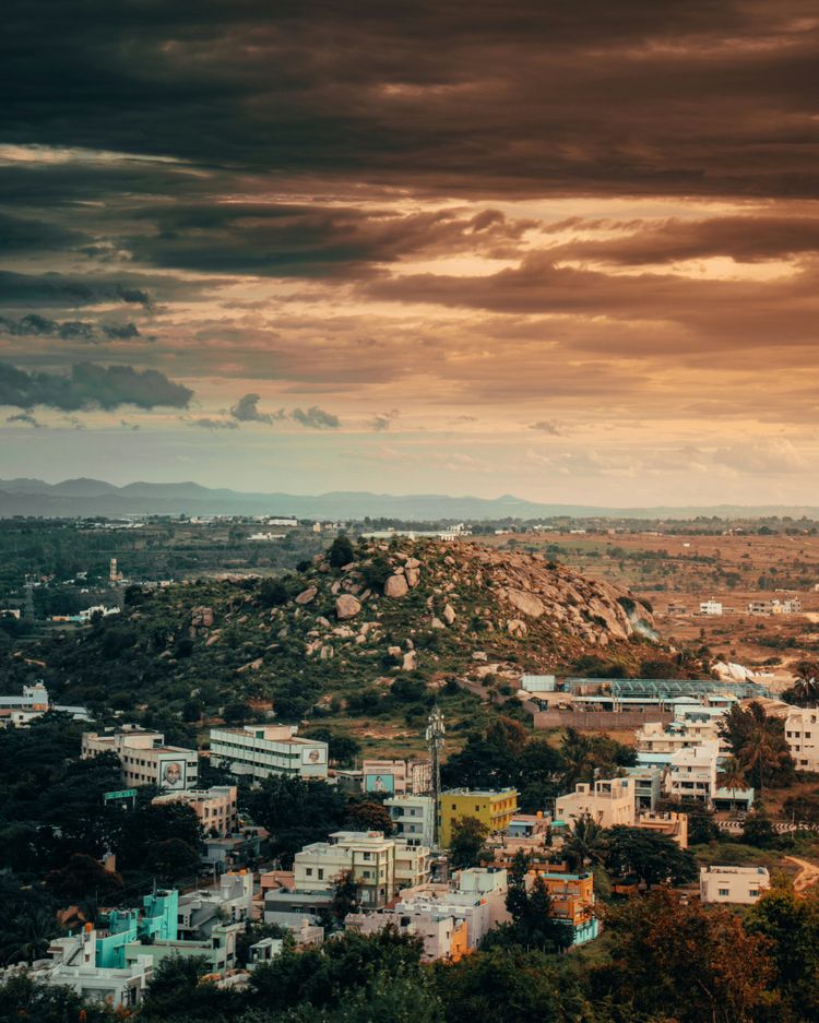 a view of a city with a mountain in the background