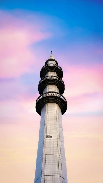 white and black tower under blue sky