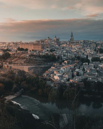 a view of a city with a river in the foreground