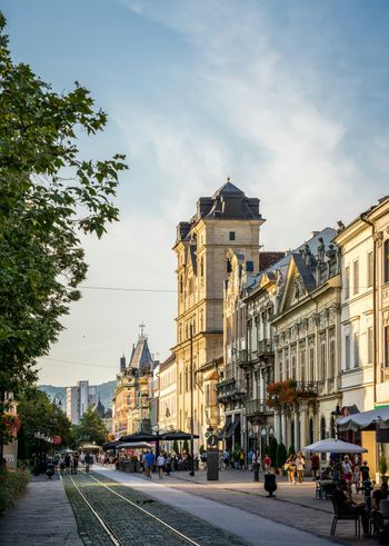 a city street with a train track running through it