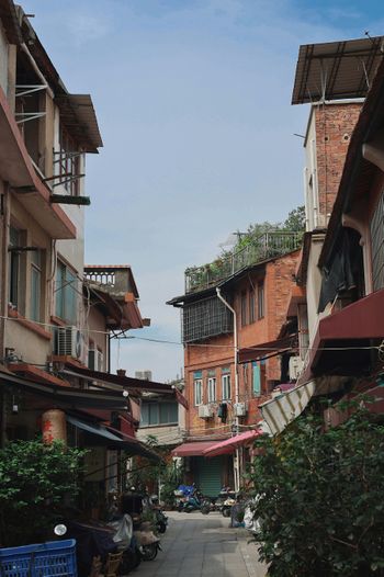 A narrow street lined with tall buildings