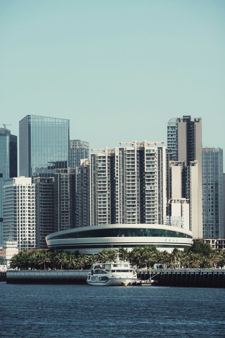 A large body of water with a city in the background