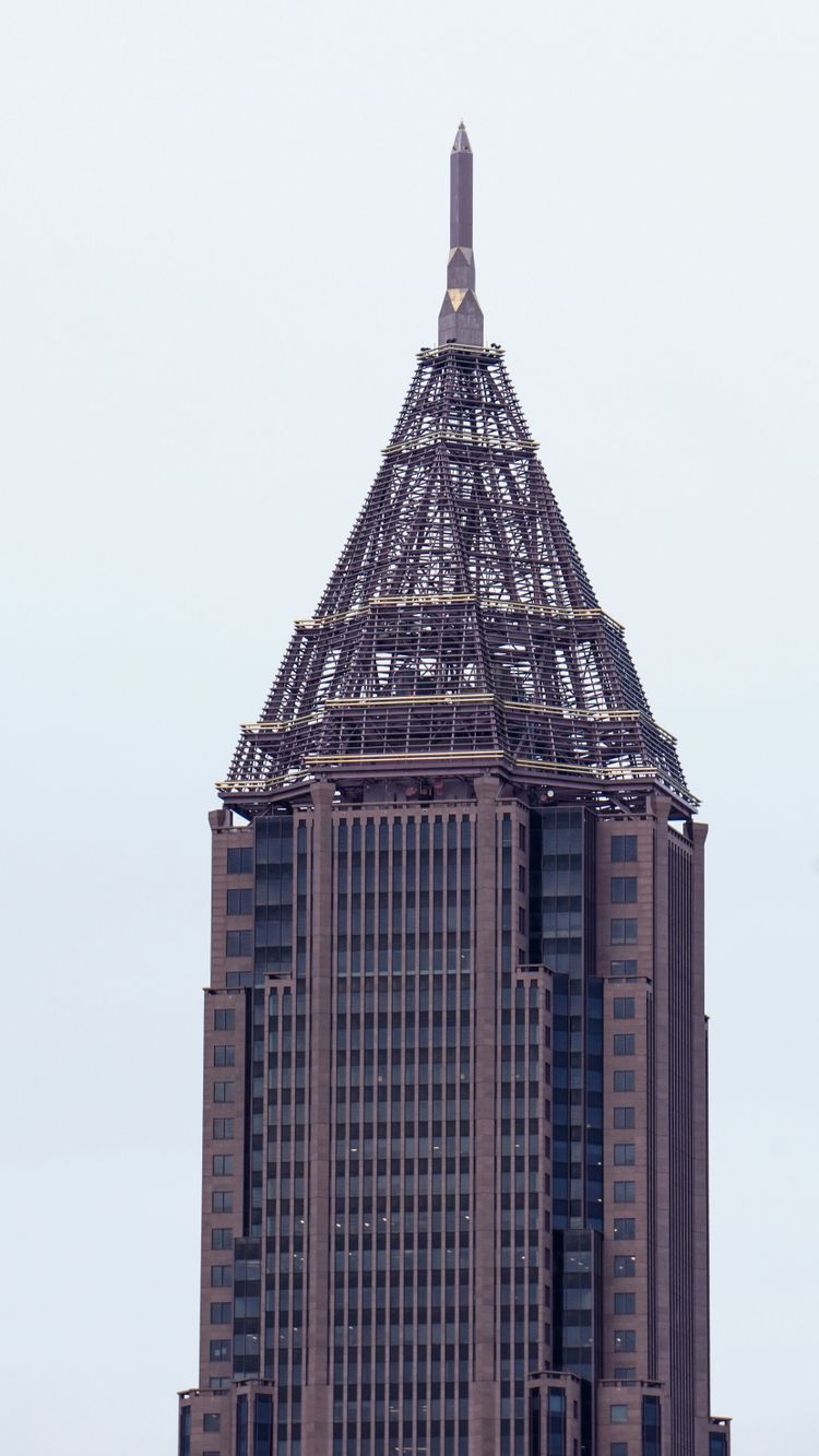 a very tall building with a clock on the top